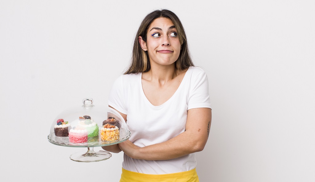 A picture of Woman confused to have the food

